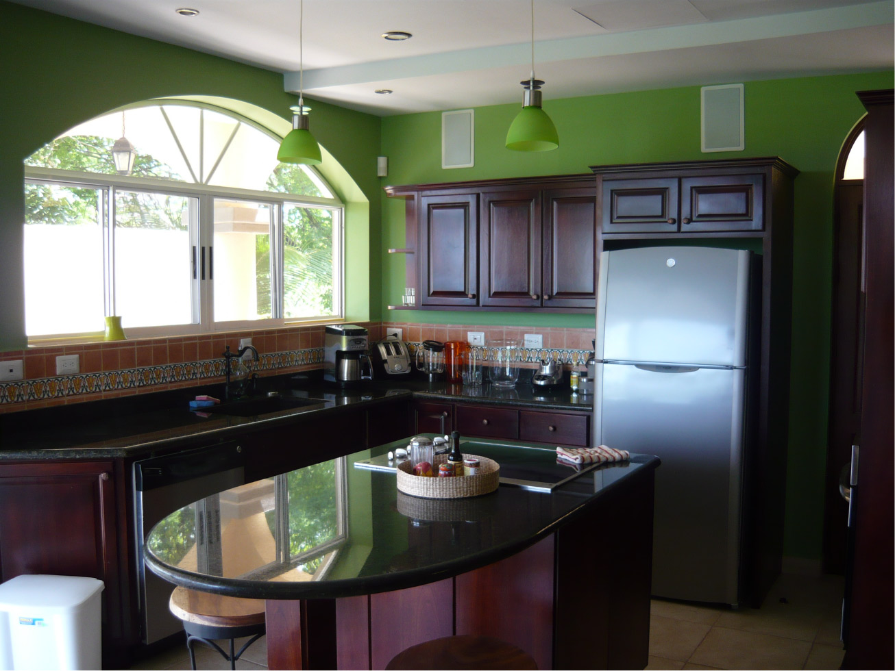 Breakfast nook with stainless steel appliances.