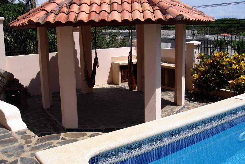 Front cabana with hammocks and sink.