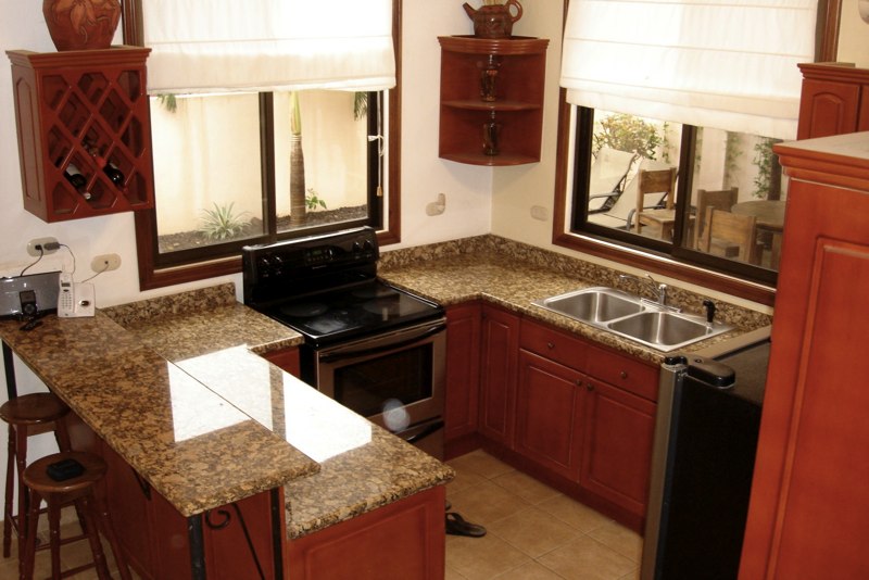 Kitchen has granite counters and stainless appliances.