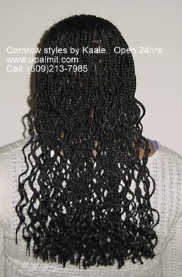 Cornrows braided in front with box braids in back, by Kaale.