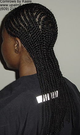 Medium cornrows with 180 degree design in back, left side view.