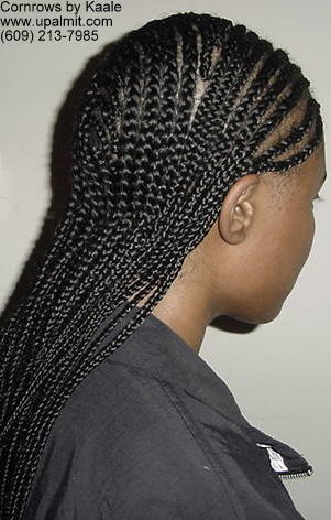 Mediium cornrows with 180 degree wave design in back, right side view.