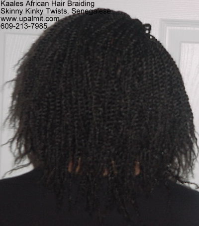 Kinky twists hide receding hairline and male pattern baldness.