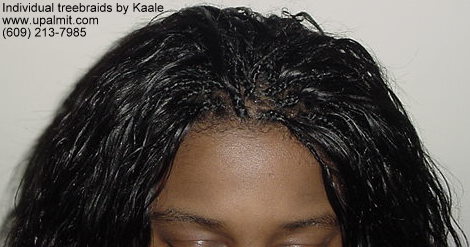 Individual treebraids with wet and wavy human hair, top.