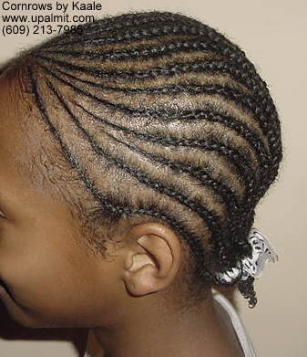 Cornrows styles with design on left side.