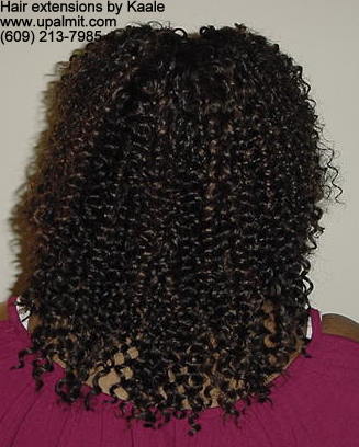 Hair extensions, hair weave, back view.