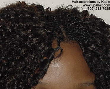 Hair extensions, hair weave, with microbraids.