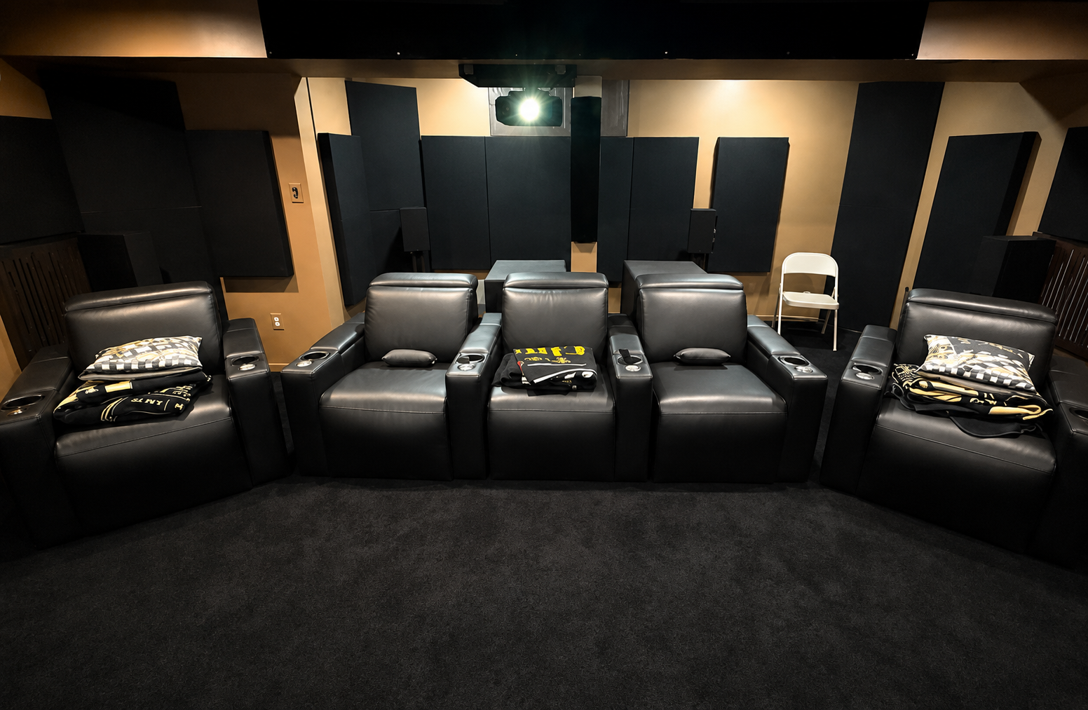 Acoustic panels installed across the side and rear walls of a dedicated home theater