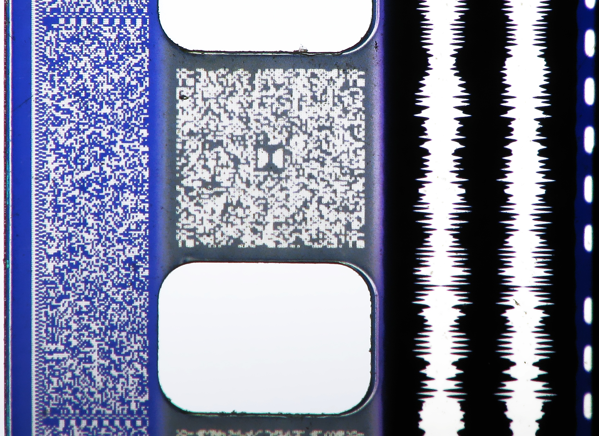 Macro photograph of analog and digital sound formats on 35mm film