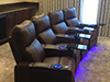 ht design brown southampton media room seats curved row of 4 led baselighting, lighted cupholders & tray tables