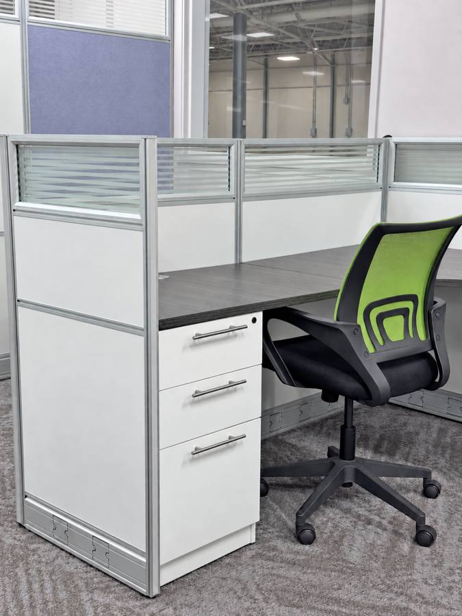 Cubicle workstation with frosted glass panel tops in the showroom