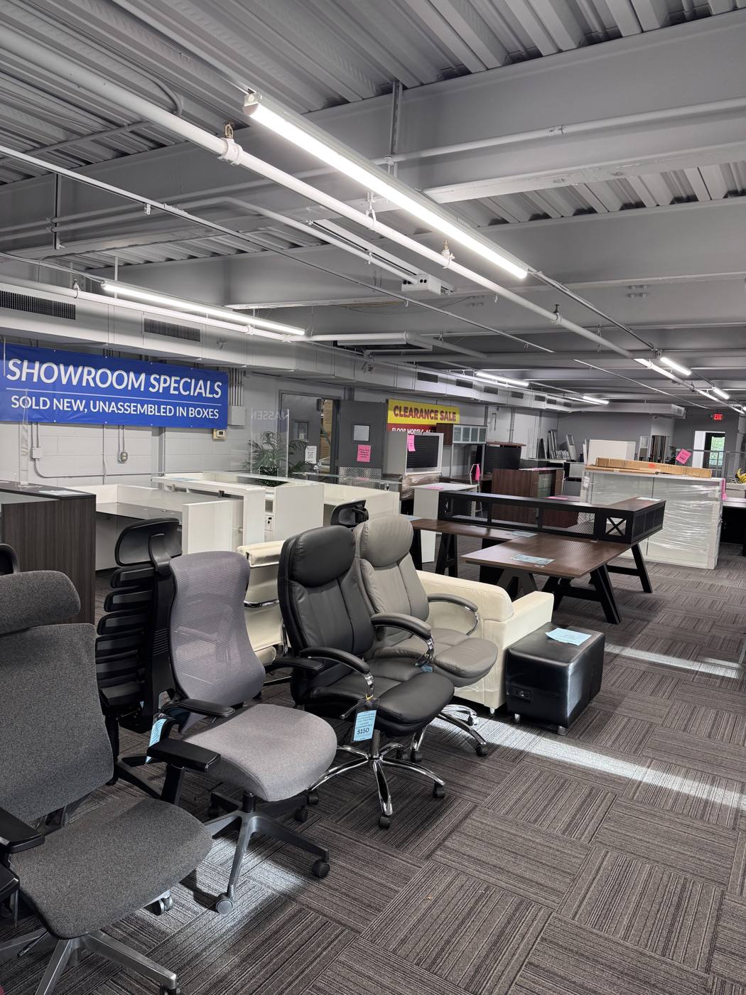 Modern Office showroom floor in Eden Prairie with office chairs, desks and showroom specials