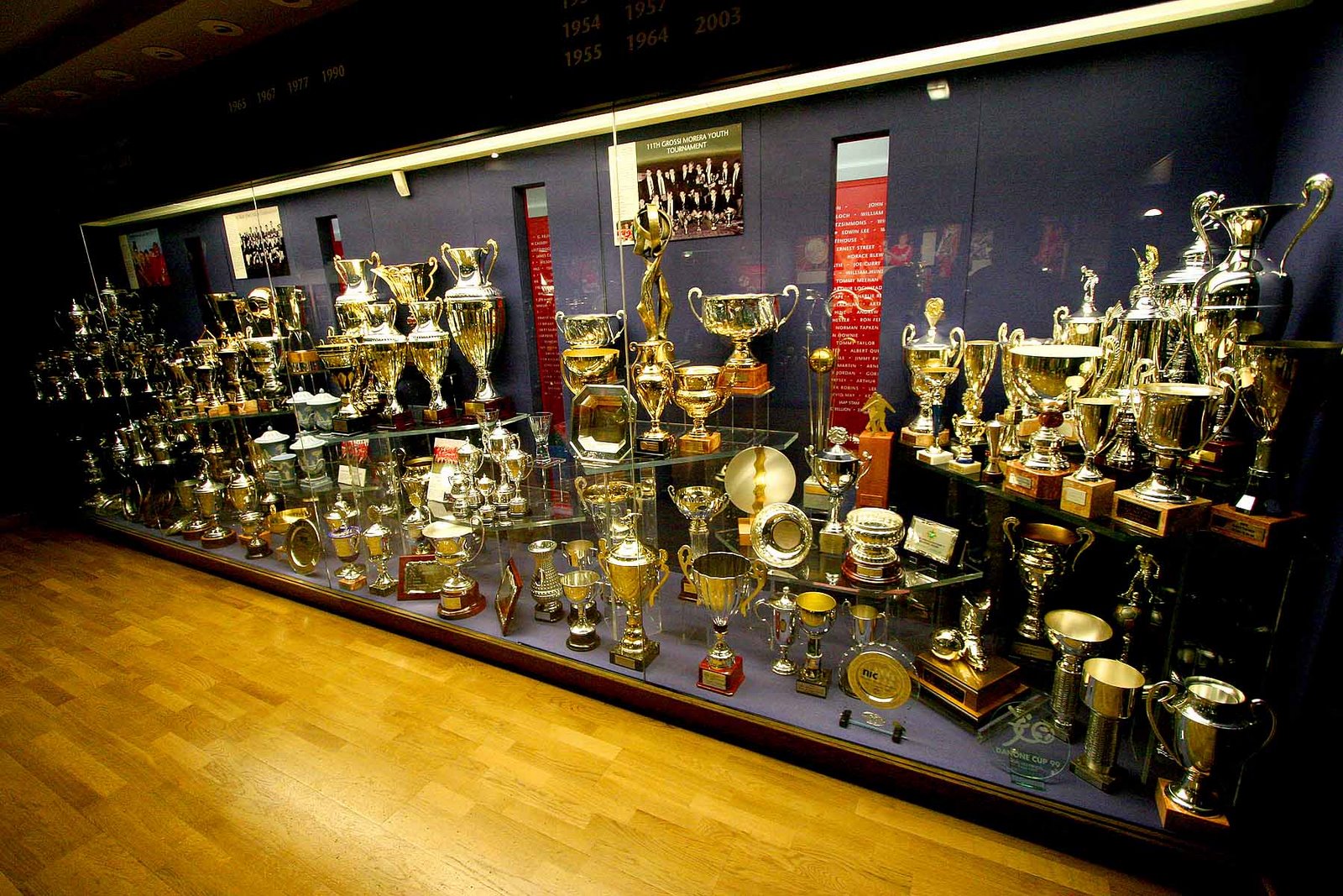 Glass display filled with trophies