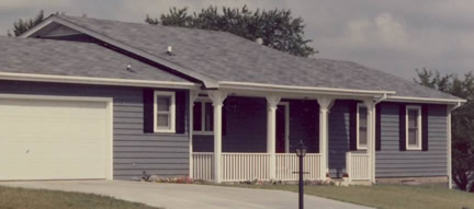 1-story, low front eave, eith raised roof section (Porch Photo 67)