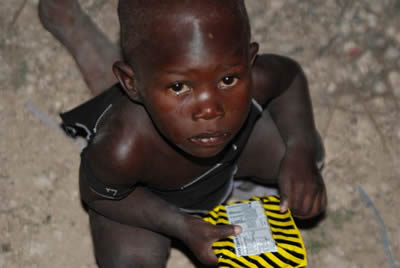 Mayday Food Bar enjoyed by a Haitian child.