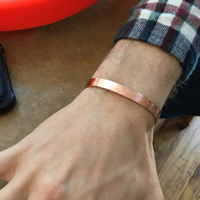 Brushed copper cuff string of jewels