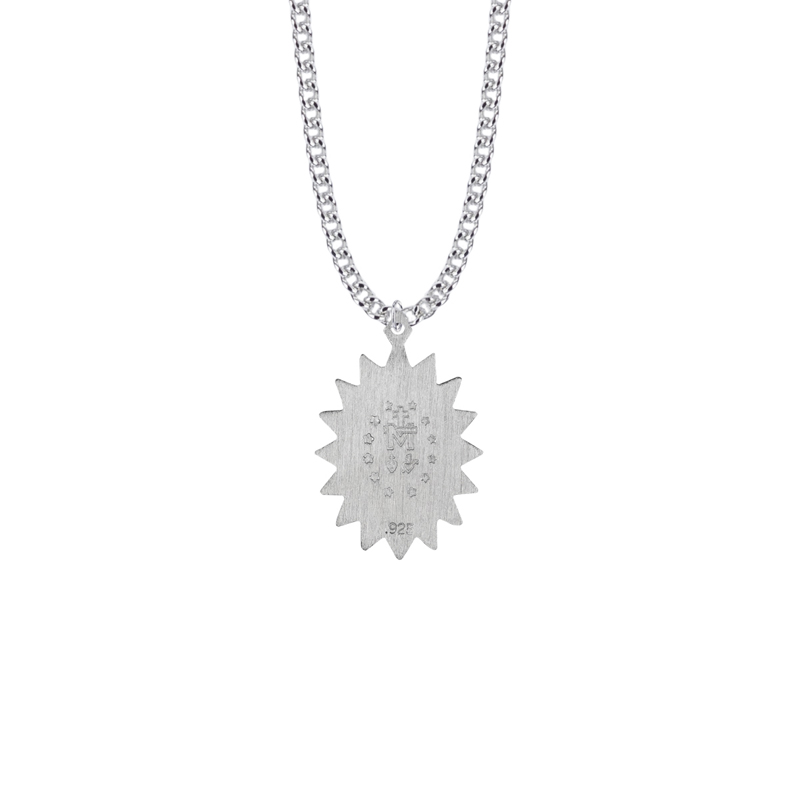 A silver Patron Saint medal on a white background. The medal represents faith and devotion for one's religion.